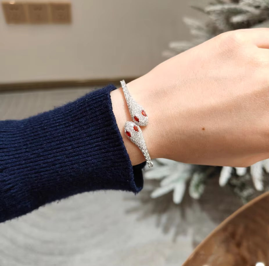 Model wearing silver double head moissanite snake bracelet with red cubic zirconia accents – Sensitive Stones