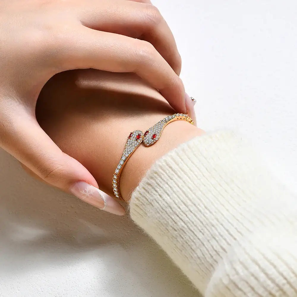 Model wearing gold double head moissanite snake bracelet with red cubic zirconia – Sensitive Stones