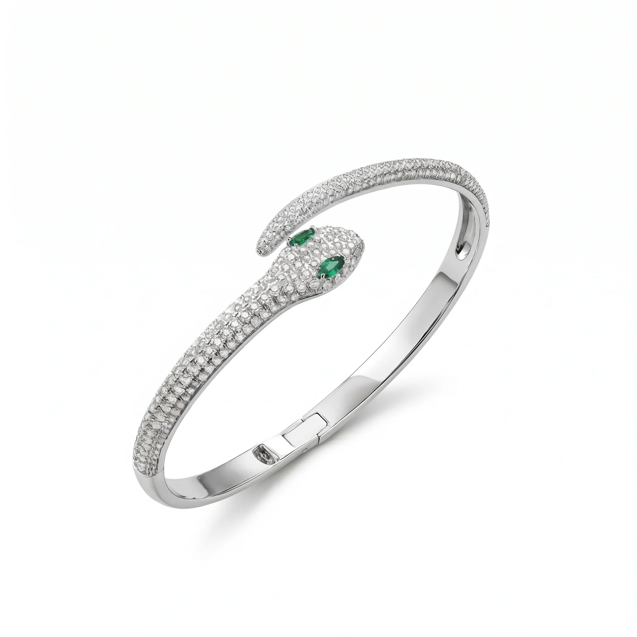 Moissanite snake bracelet in 925 sterling silver with a white gold finish, a pavé serpent hinged bangle with green lab-created emerald eyes, on a white background - Sensitive Stones