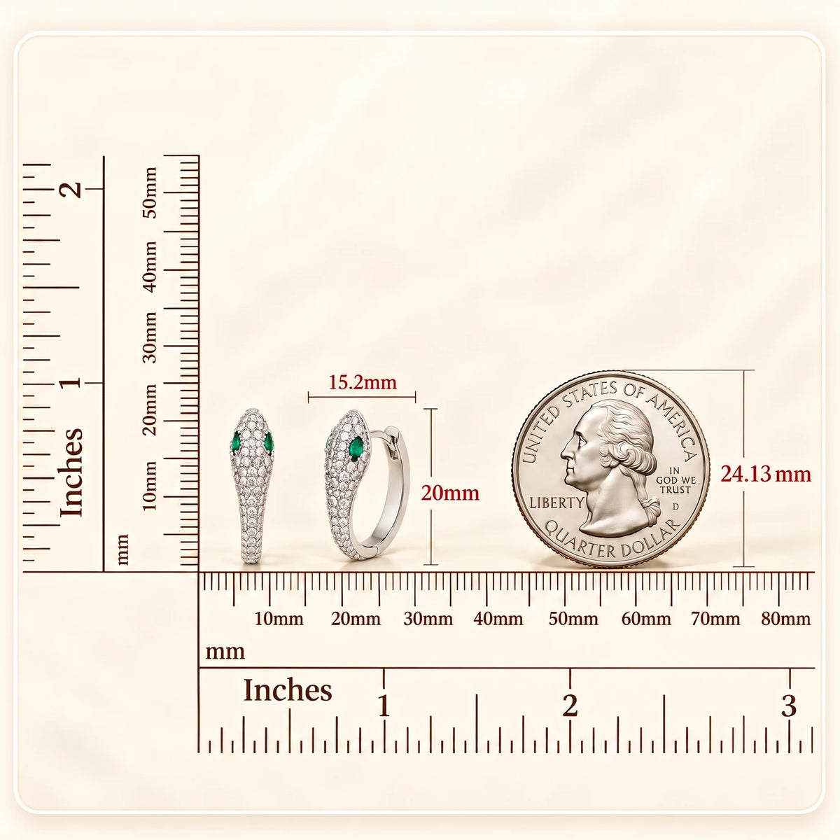 Small moissanite snake hoop earrings in a white gold finish next to a ruler and a US quarter, measuring 15.2mm wide and 20mm tall - Sensitive Stones