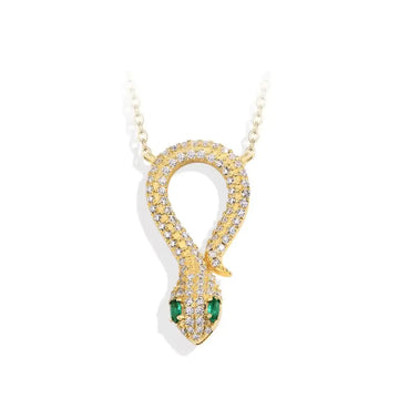 Moissanite snake pendant with round brilliant stones and green nano accents in 18K gold plating on white background - Sensitive Stones