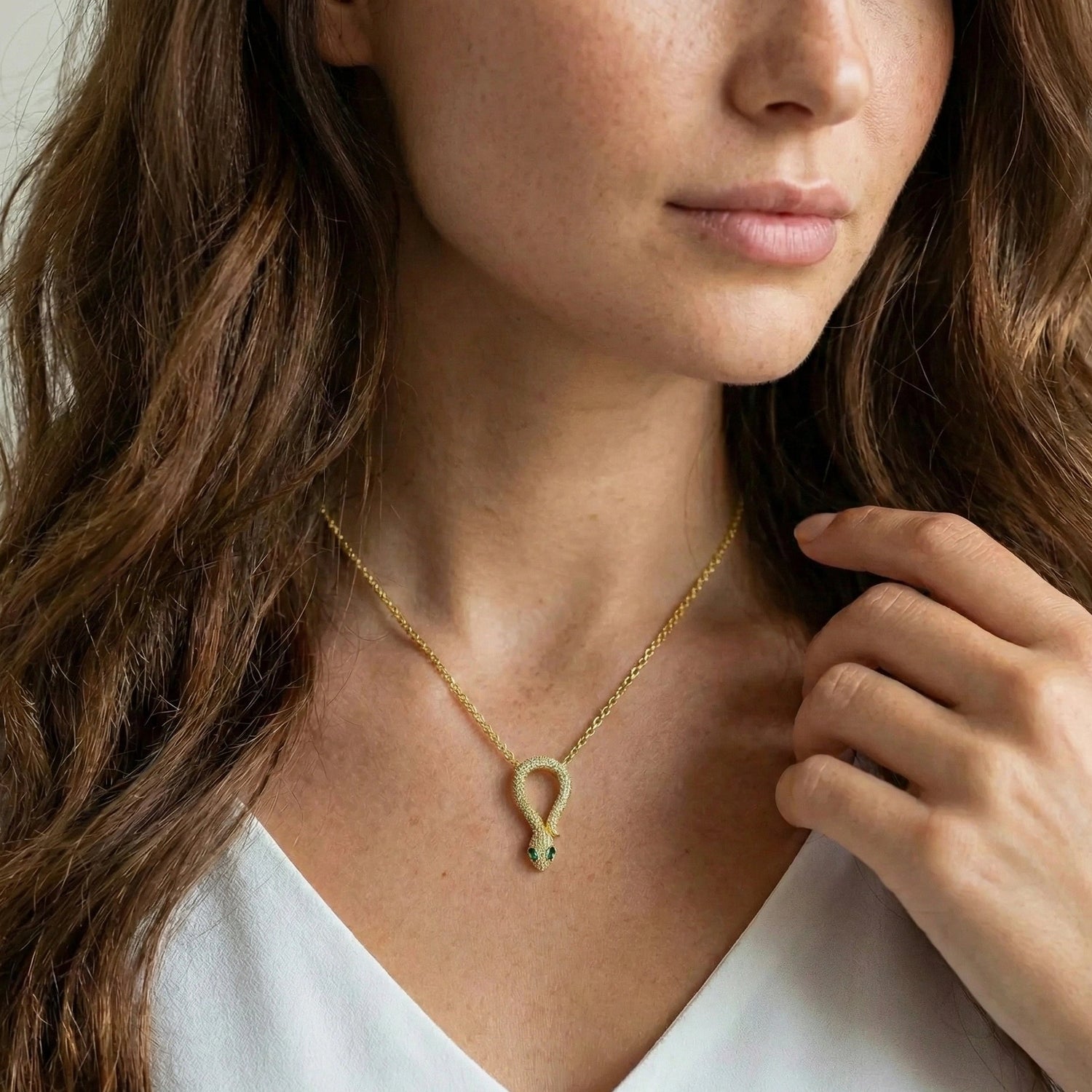 Woman wearing moissanite snake pendant necklace in 18K yellow gold plating with adjustable chain - Sensitive Stones