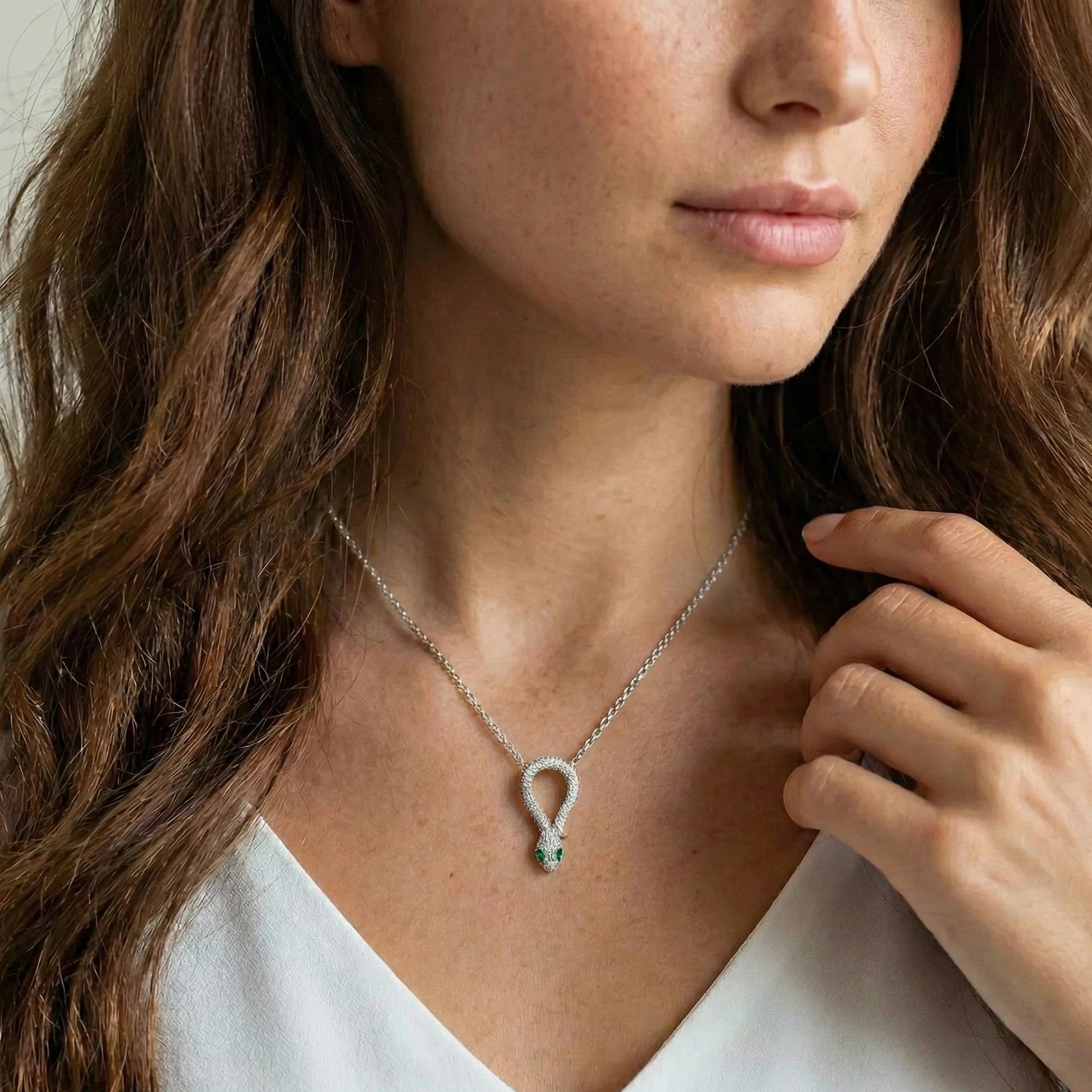 Moissanite snake pendant featuring D color VVS1 stones and serpent design with green nano stones in sterling silver - Sensitive Stones
