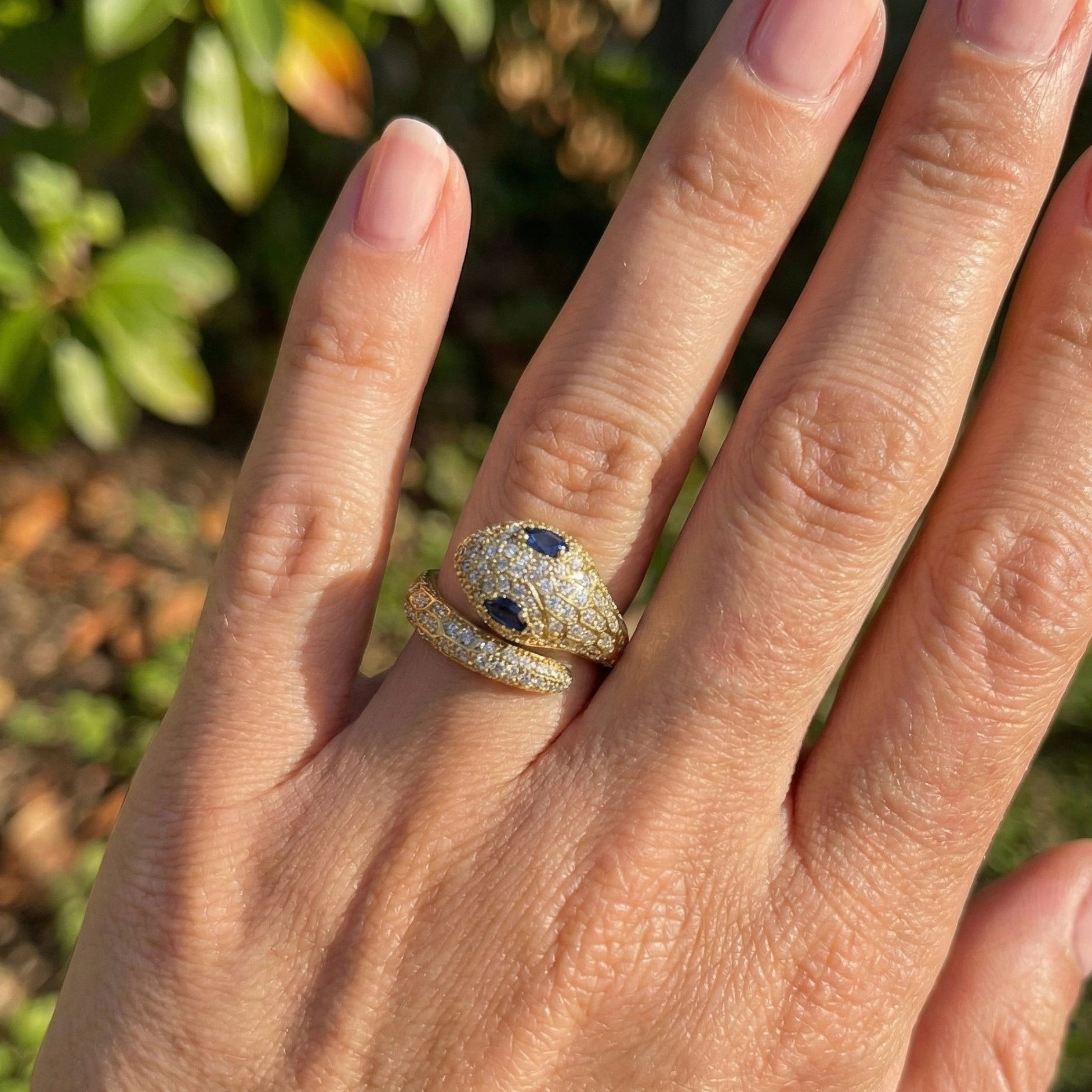 Elegant Snake Moissanite Snake Ring with lab sapphire eyes in 925 Silver with 18k gold plating worn on hand, featuring dazzling pavé details - Sensitive Stones