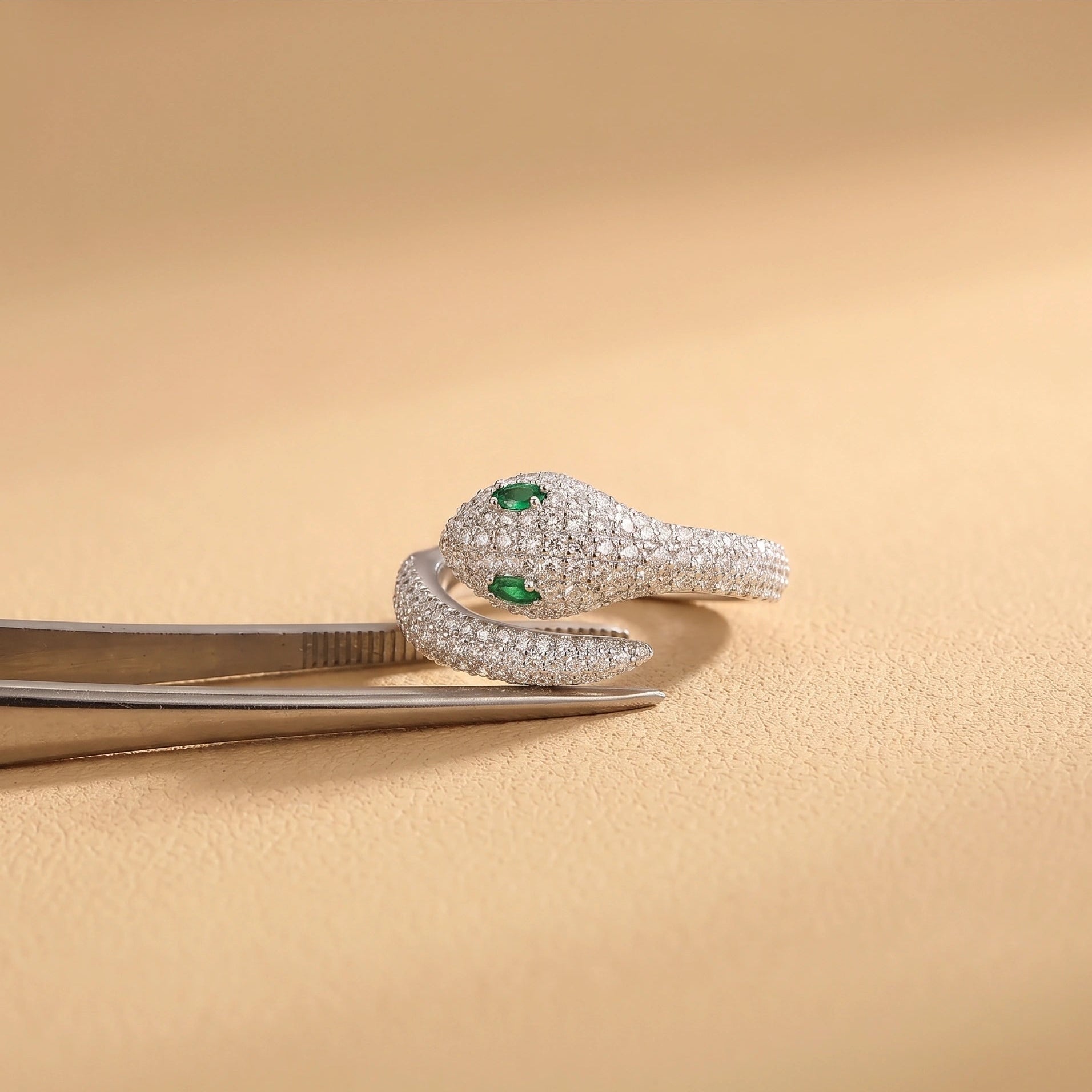 Close-up detail of Moissanite Snake Ring showing intricate moissanite pavé setting and lab created emerald accents with magnification - Sensitive Stones