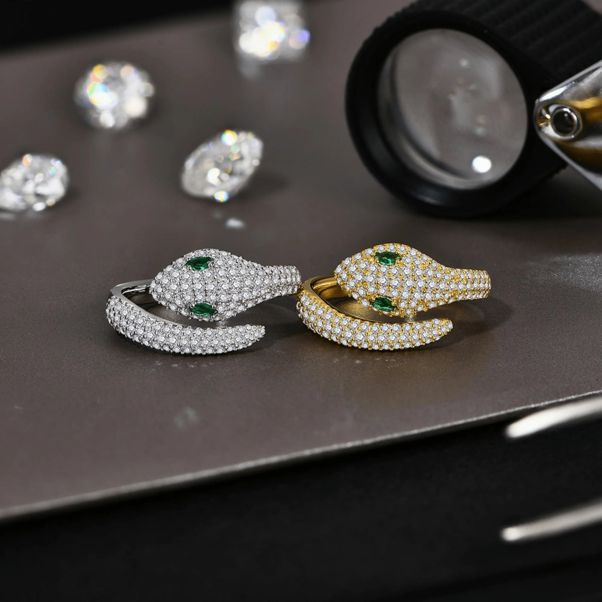Moissanite snake rings in gold and silver with green gemstone eyes, symbolic serpent jewelry | Sensitive Stones