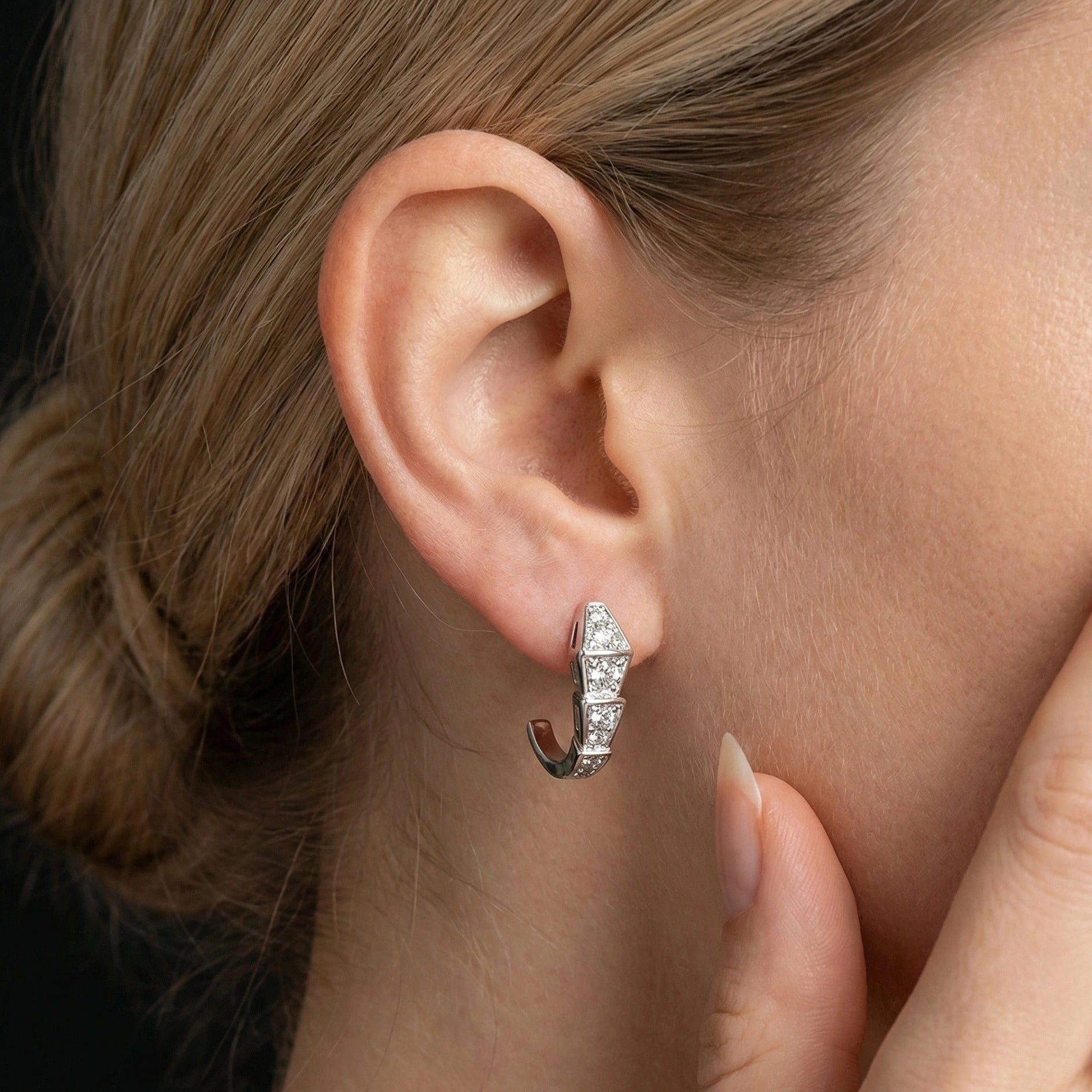Model close-up showing moissanite snake spine silver earrings, elegant sculptural sparkle style – Sensitive Stones