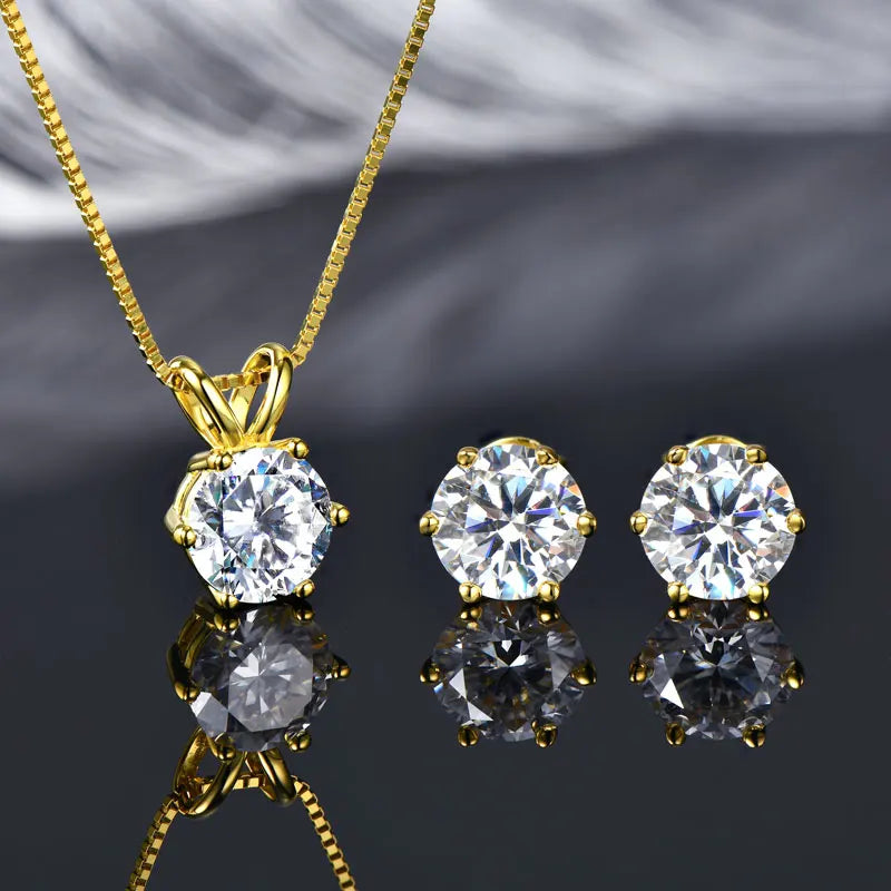 Studio shot of silver moissanite solitaire necklace and matching stud earrings in yellow gold, showing classic 6-prong setting and vibrant shine - Sensitive Stones