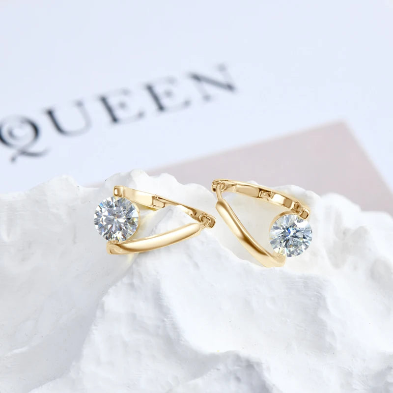 Moissanite Solitaire Twist Hoop Earrings in gold on white display, D color stones in 925 sterling silver hoops - Sensitive Stones