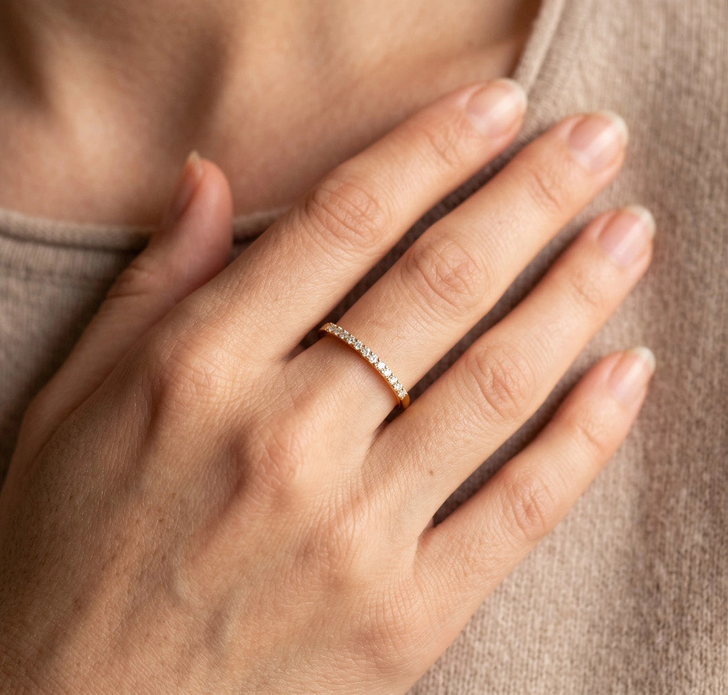 Woman wearing the moissanite stackable ring in 14K gold filled on her ring finger - Sensitive Stones