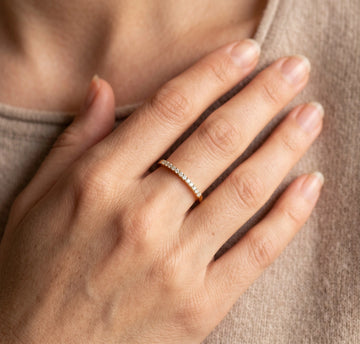 Woman wearing the moissanite stackable ring in 14K gold filled on her ring finger - Sensitive Stones