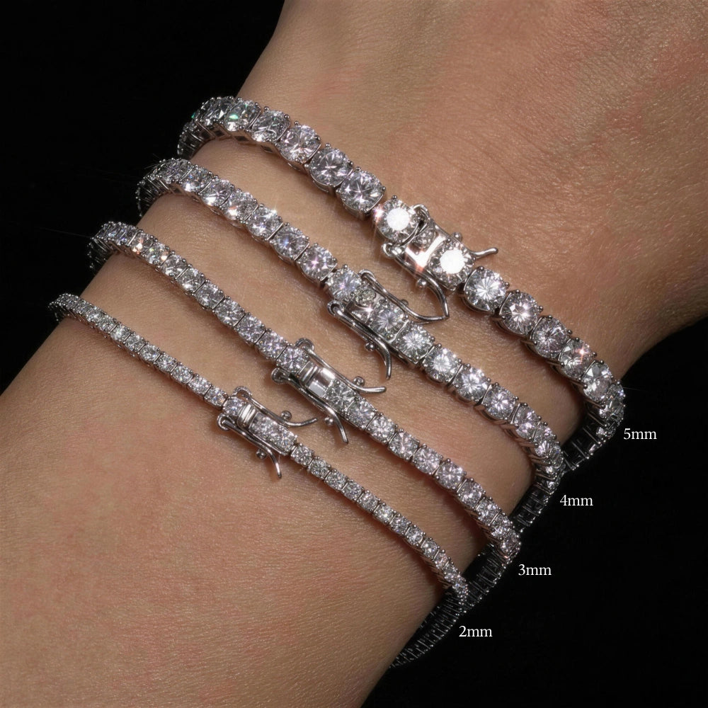 Size comparison of moissanite tennis bracelets in four stone sizes 2mm, 3mm, 4mm, 5mm stacked on a female wrist on a black background - Sensitive Stones