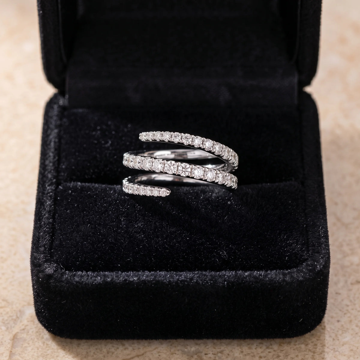 Moissanite triple wrap spiral ring in a white gold finish presented in a black velvet gift box - Sensitive Stones