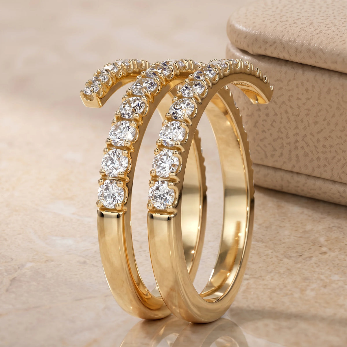 Side profile of the moissanite triple wrap spiral ring in a yellow gold finish showing how the three coils sit apart - Sensitive Stones