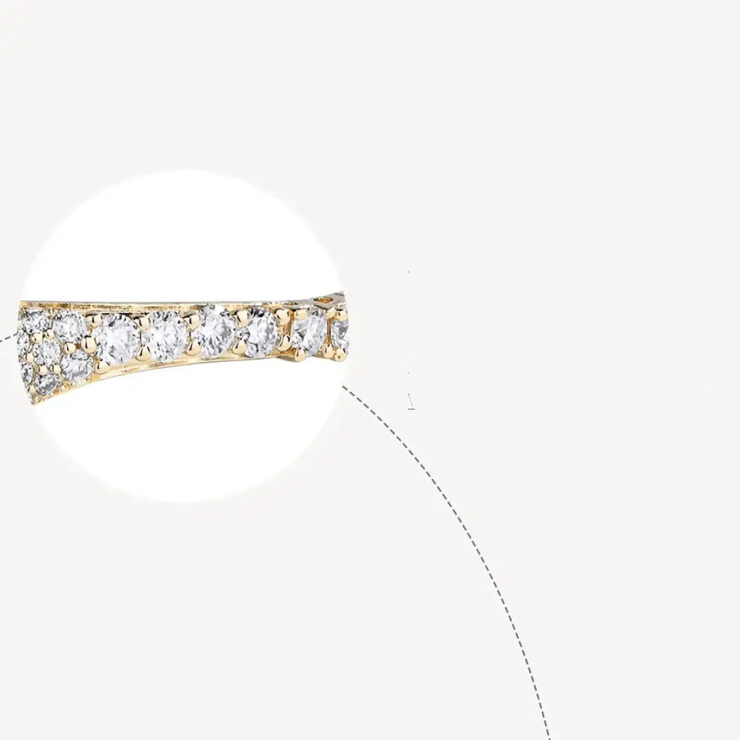 Magnified view of the prong-set moissanite stone row on the moissanite twin snake bracelet in a yellow gold finish - Sensitive Stones