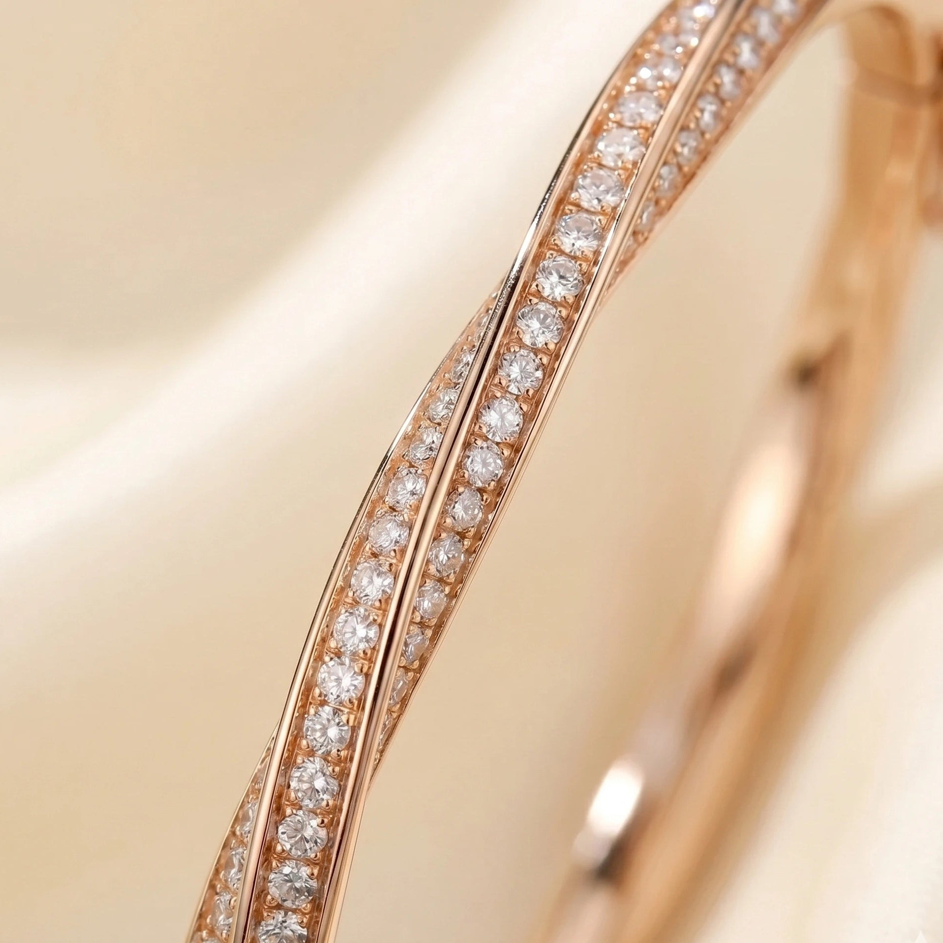 Close up detail of 2mm VVS1 moissanite stones on rose gold twist bangle - Sensitive Stones