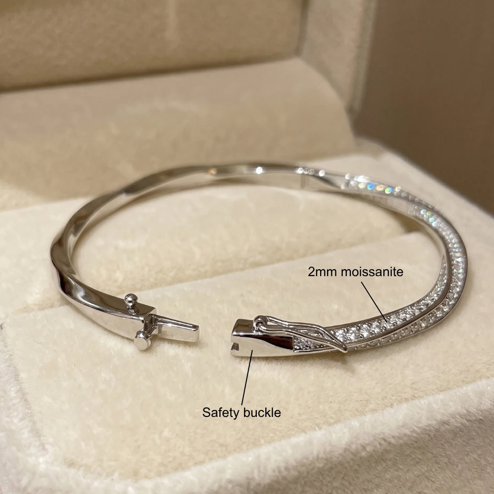Close up of moissanite twist bangle showing 2mm moissanite stones and safety buckle clasp - Sensitive Stones
