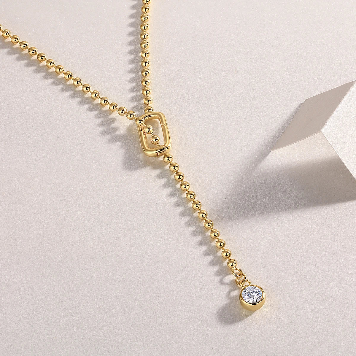 Close-up of Moissanite Y-Shape Necklace’s gold-plated bead chain and 1 ct drop pendant – Sensitive Stones