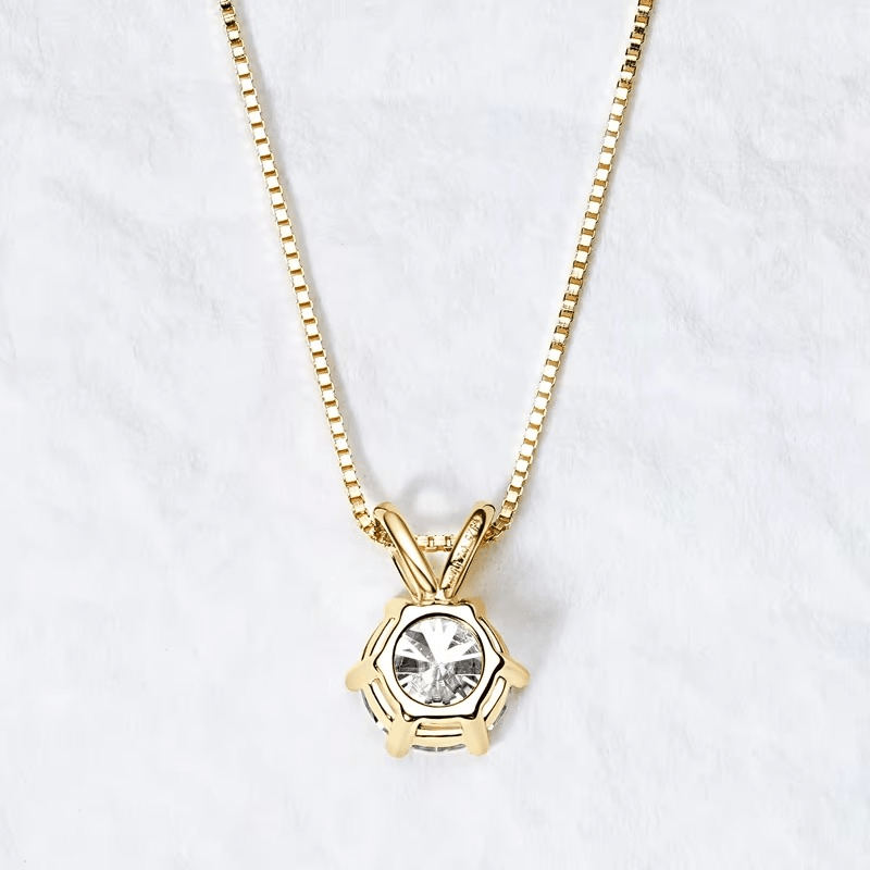Moissanite necklace with 6-prong solitaire pendant with 18k gold finish on a white background showing the details of the back of pendant- Sensitive Stones