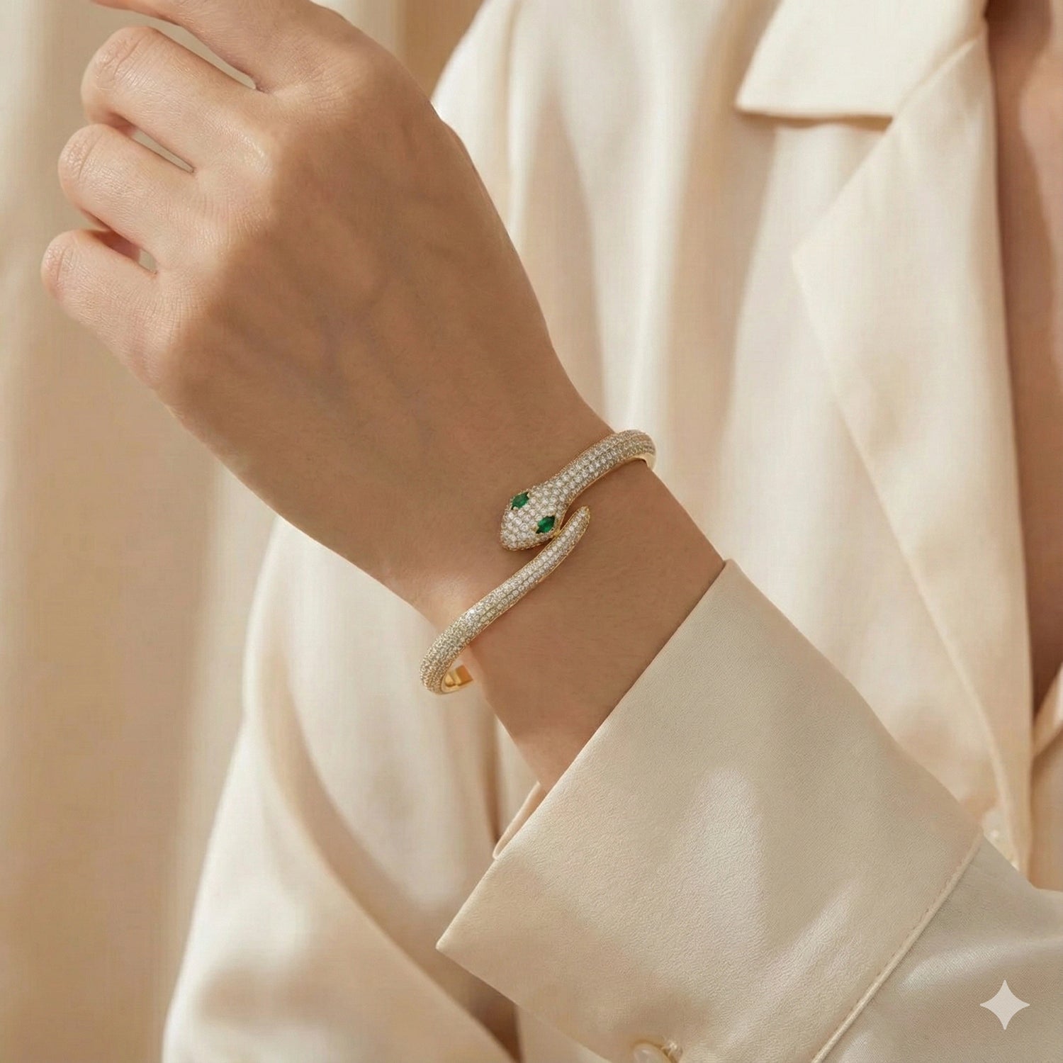 Woman wearing moissanite snake bracelet in 925 silver with gold finish on left wrist - Sensitive Stones