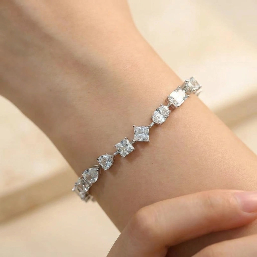 Woman wearing the multi shape moissanite tennis bracelet in white gold - Sensitive Stones