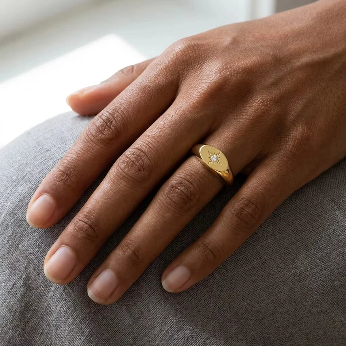North star moissanite signet ring in 14K gold filled worn on the finger, showing how low and flat the oval face sits - Sensitive Stones