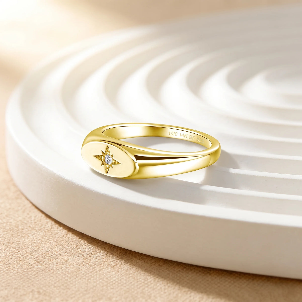 North star moissanite signet ring in 14K gold filled at an angle, showing the recessed star and the tapered polished shoulders - Sensitive Stones