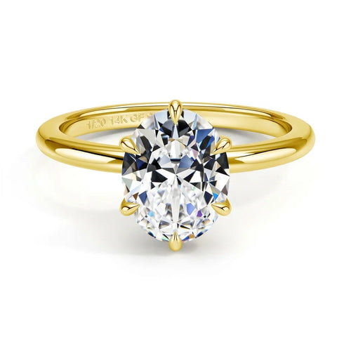 Oval cut moissanite engagement ring in 14K gold filled with a 2ct D color VVS1 stone in a six prong setting