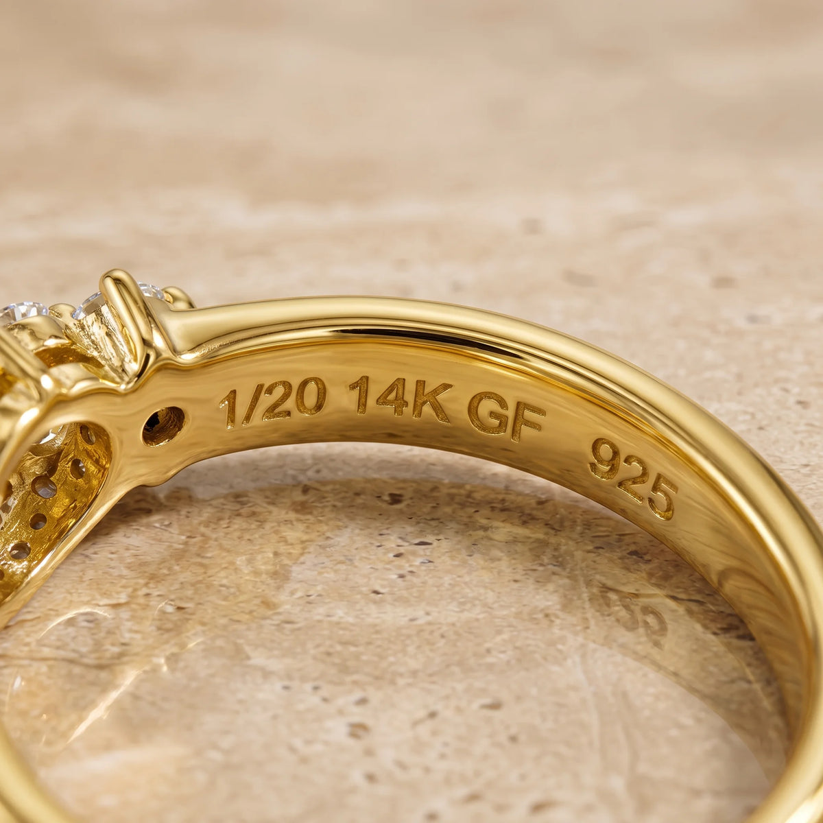 Close-up of the 1/20 14K GF 925 stamp inside the band of the oval moissanite engagement ring - Sensitive Stones