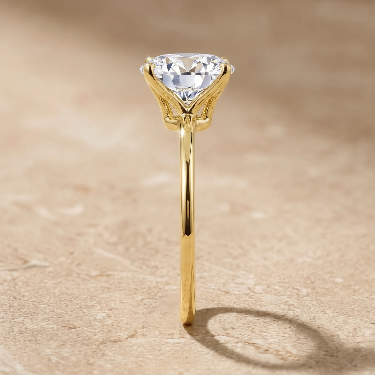 Side profile of a 14K gold filled oval moissanite engagement ring showing the slender band