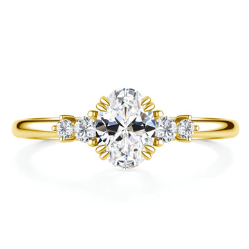 Oval cut moissanite engagement ring with four 5A cubic zirconia side stones in 14K gold filled on a white background - Sensitive Stones