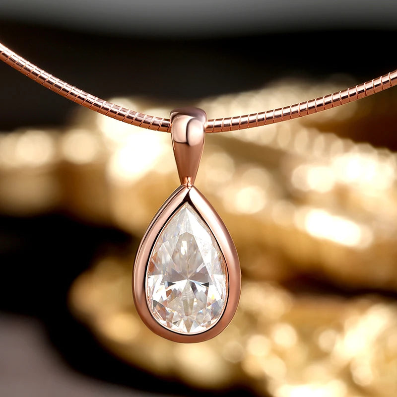 Detailed close-up of Pear Cut Moissanite Solitaire Pendant Necklace in rose gold, bezel setting, snake chain, VVS1 moissanite - Sensitive Stones
