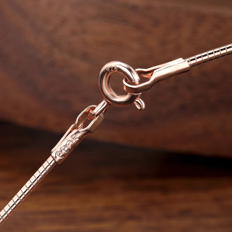 Close-up of 925 sterling silver and rose gold snake chain clasp for Pear Cut Moissanite Solitaire Pendant Necklace, tarnish resistant - Sensitive Stones