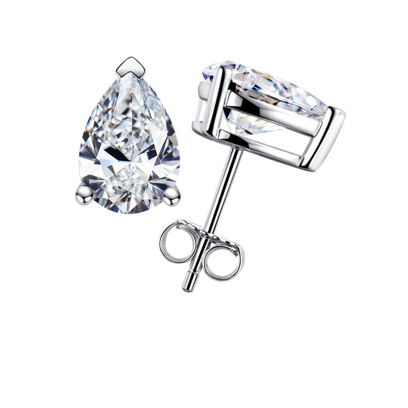 Pear cut moissanite stud earrings in 18K white gold plated sterling silver, front and side view with three-prong setting