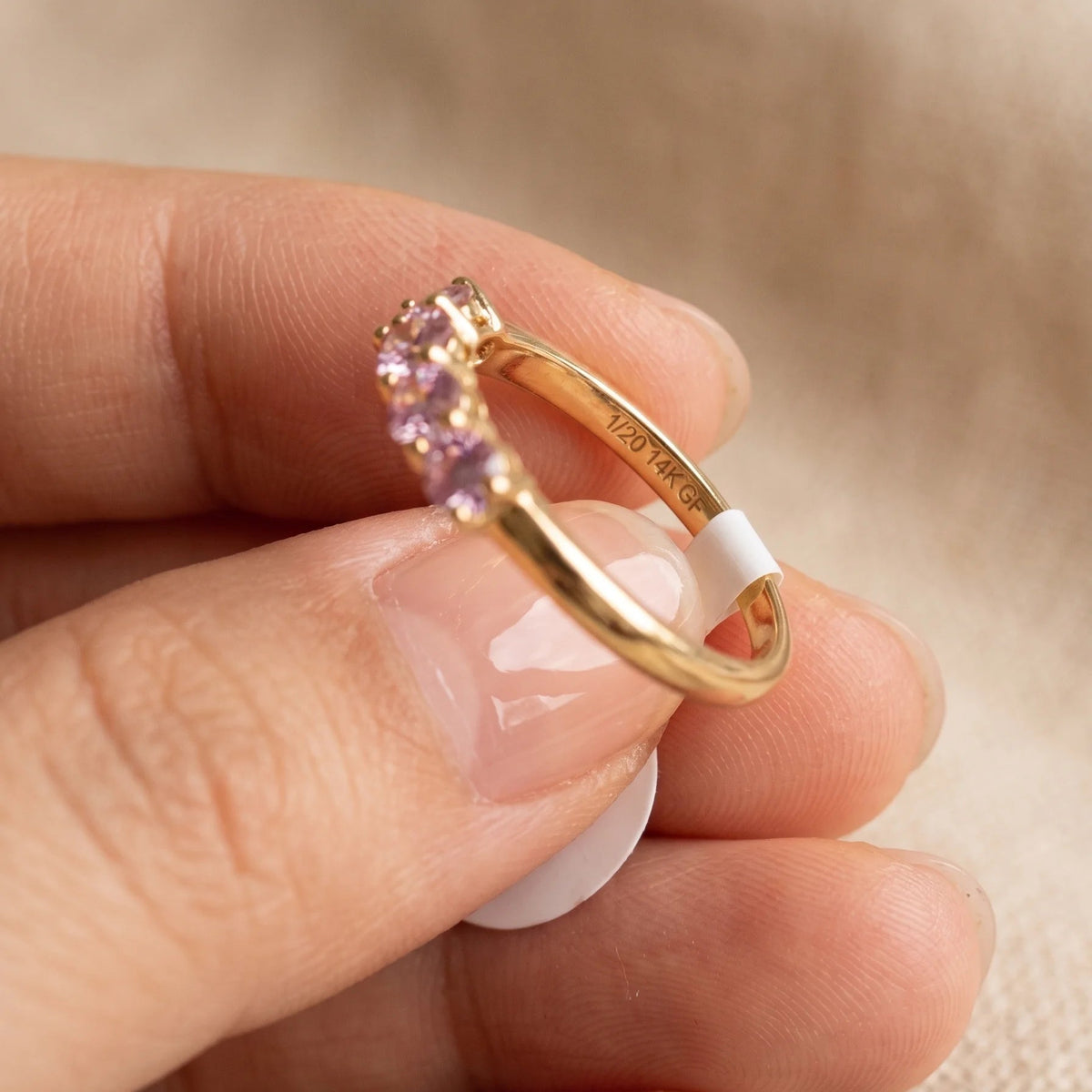 Close-up of the pink moissanite five stone stackable ring in 14K gold filled, showing the shared prong claws between each pink stone - Sensitive Stones