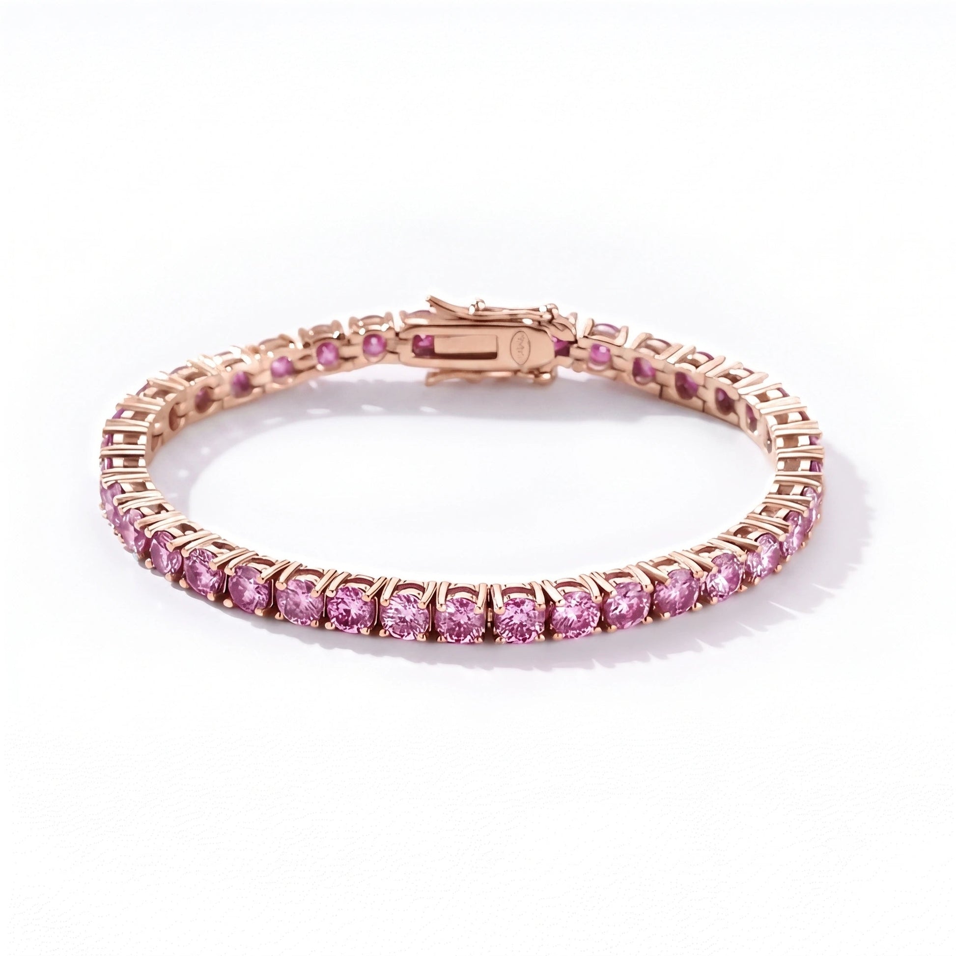 Pink moissanite tennis bracelet in 18K rose gold plated sterling silver with box clasp on white background - Sensitive Stones