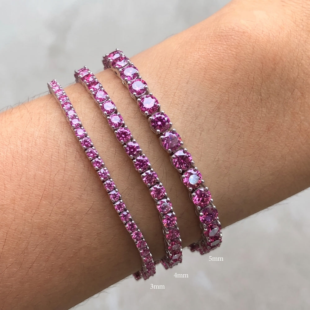 Size comparison of 3mm, 4mm and 5mm pink moissanite tennis bracelets in white gold plated sterling silver on a wrist - Sensitive Stones
