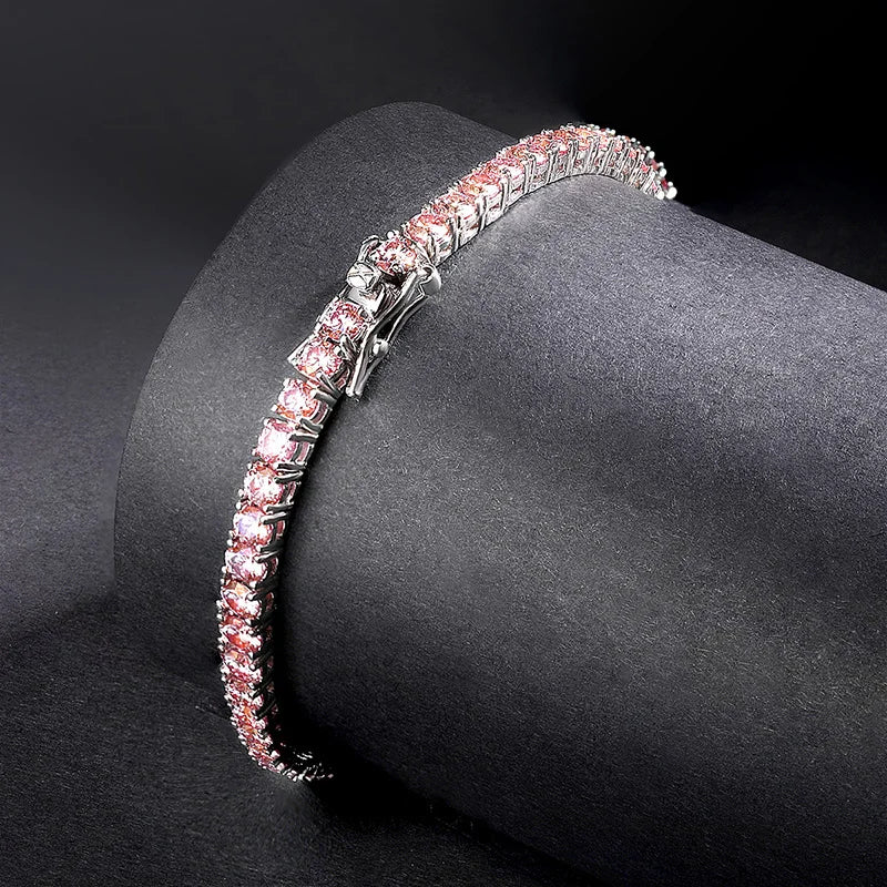 Pink Moissanite Tennis Bracelet with round-cut stones displayed on silver stand | Sensitive Stones