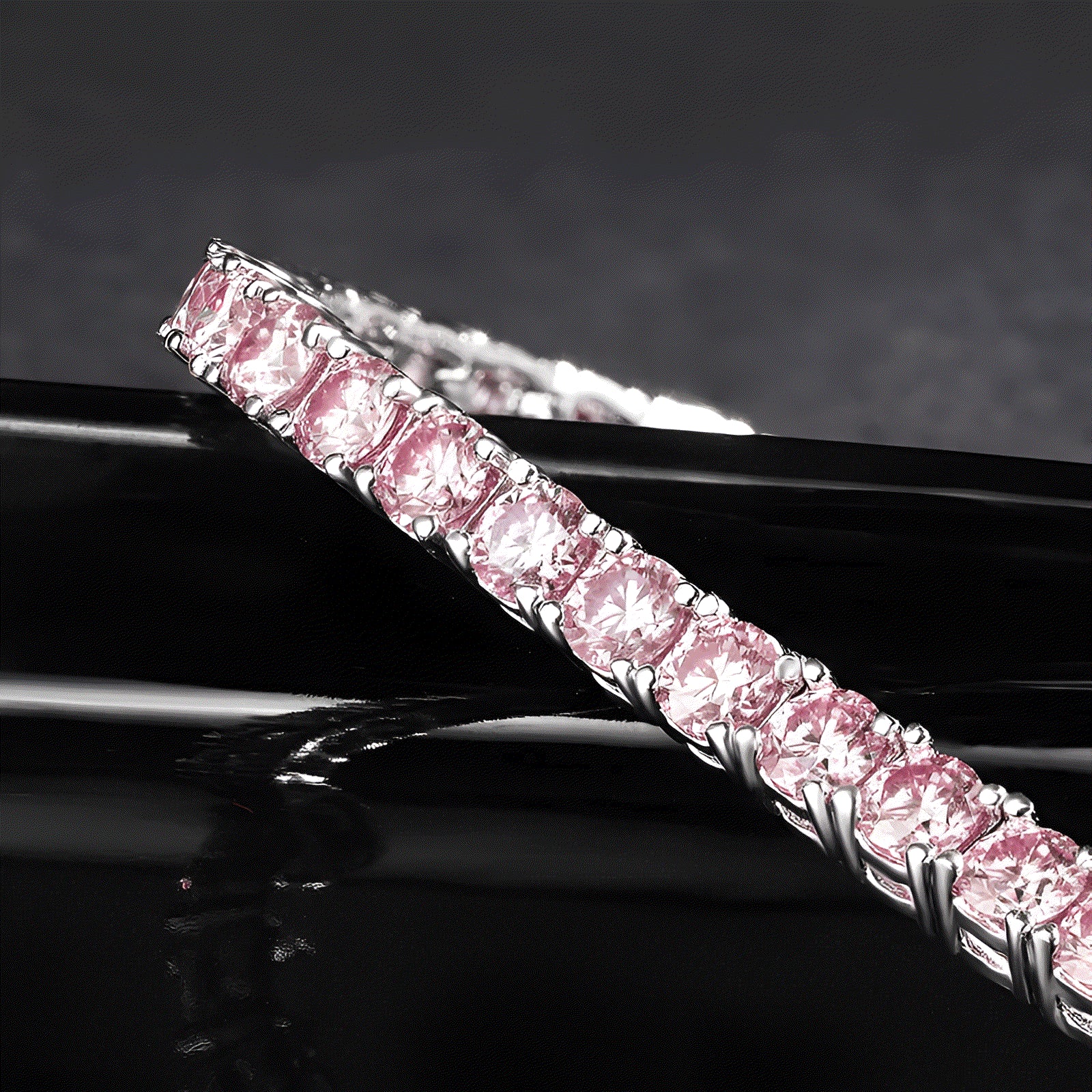 Close-up of round-cut pink moissanite stones set in 925 sterling silver bracelet | Sensitive Stones