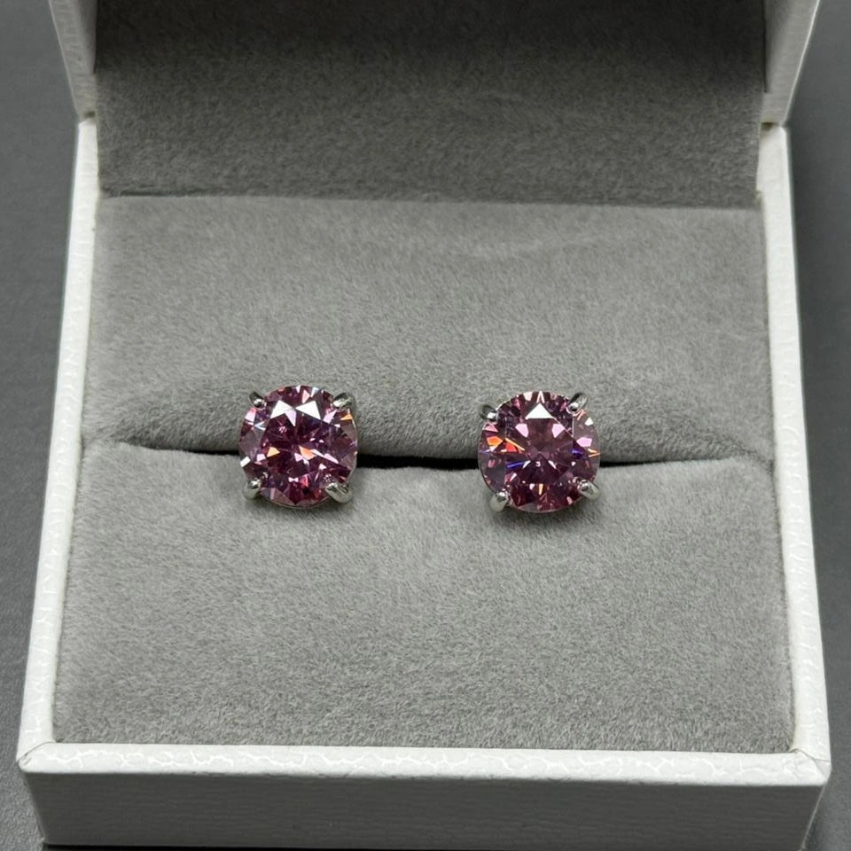 Pair of pink moissanite stud earrings in a jewelry box - Sensitive Stones