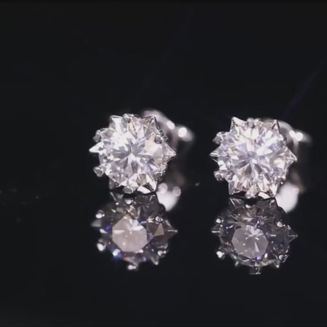 Video of moissanite snowflake stud earrings sparkling under light – GRA certified, D color VVS1 clarity, set in 18K white gold plated 925 silver - Sensitive Stones