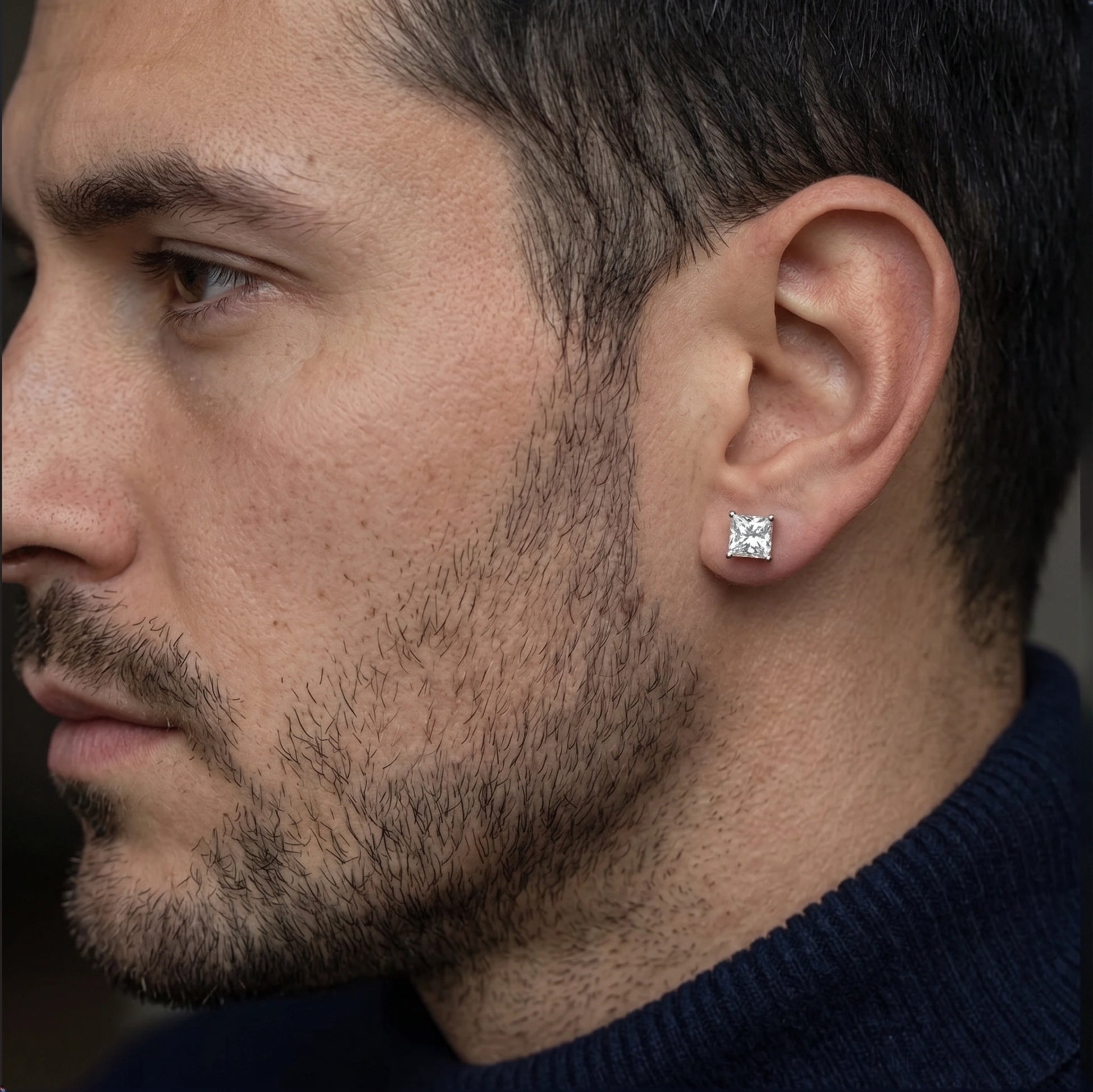 Man wearing a princess cut moissanite stud earring in white gold - Sensitive Stones