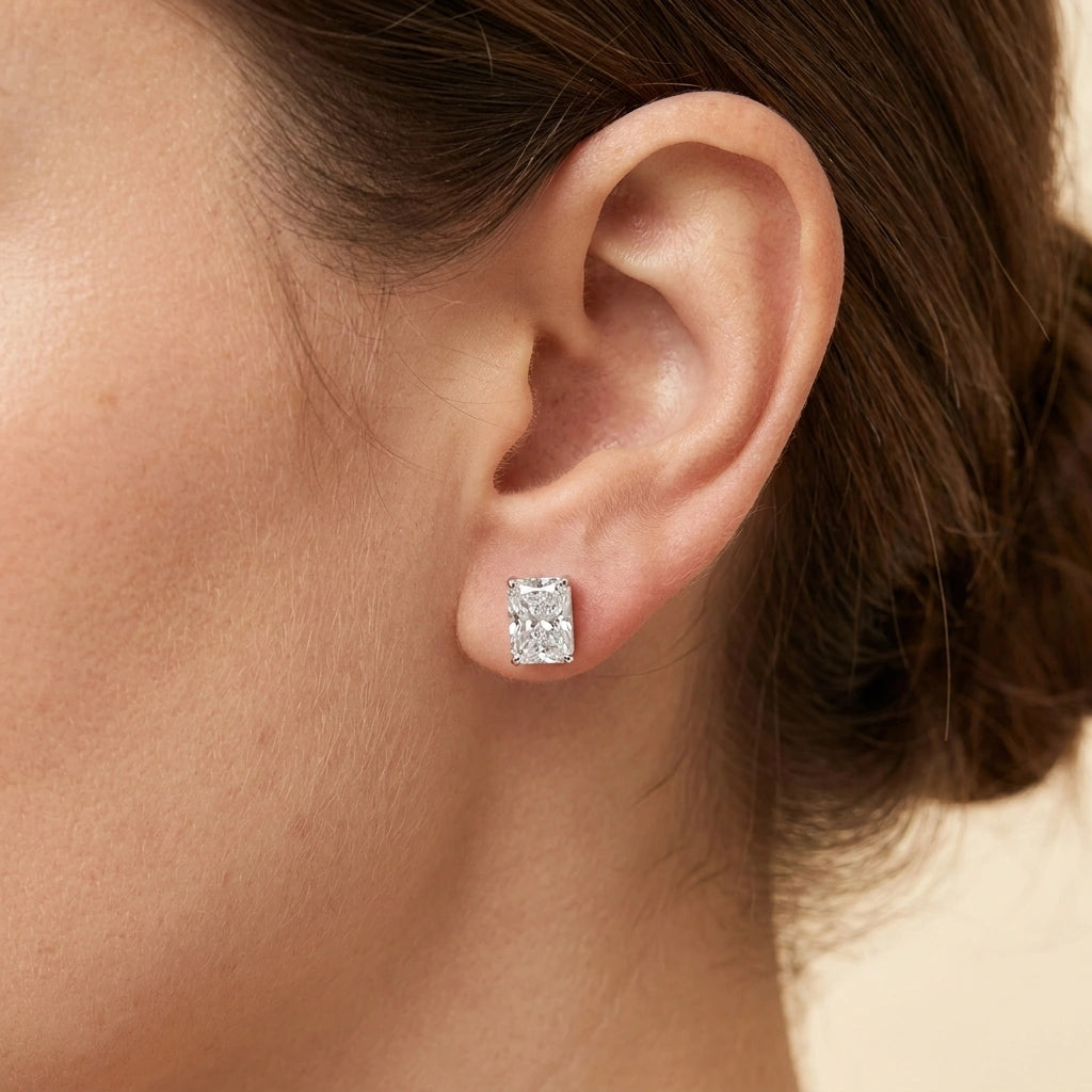 Woman wearing a radiant cut moissanite stud earring - Sensitive Stones