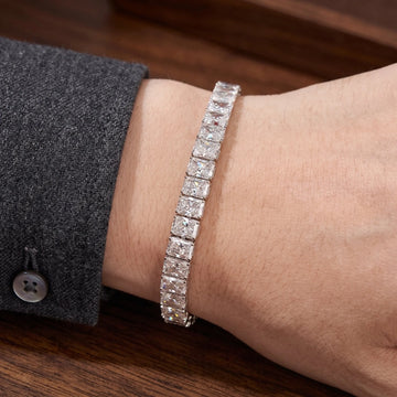 Radiant cut moissanite tennis bracelet worn on the wrist with a tailored blazer cuff - Sensitive Stones