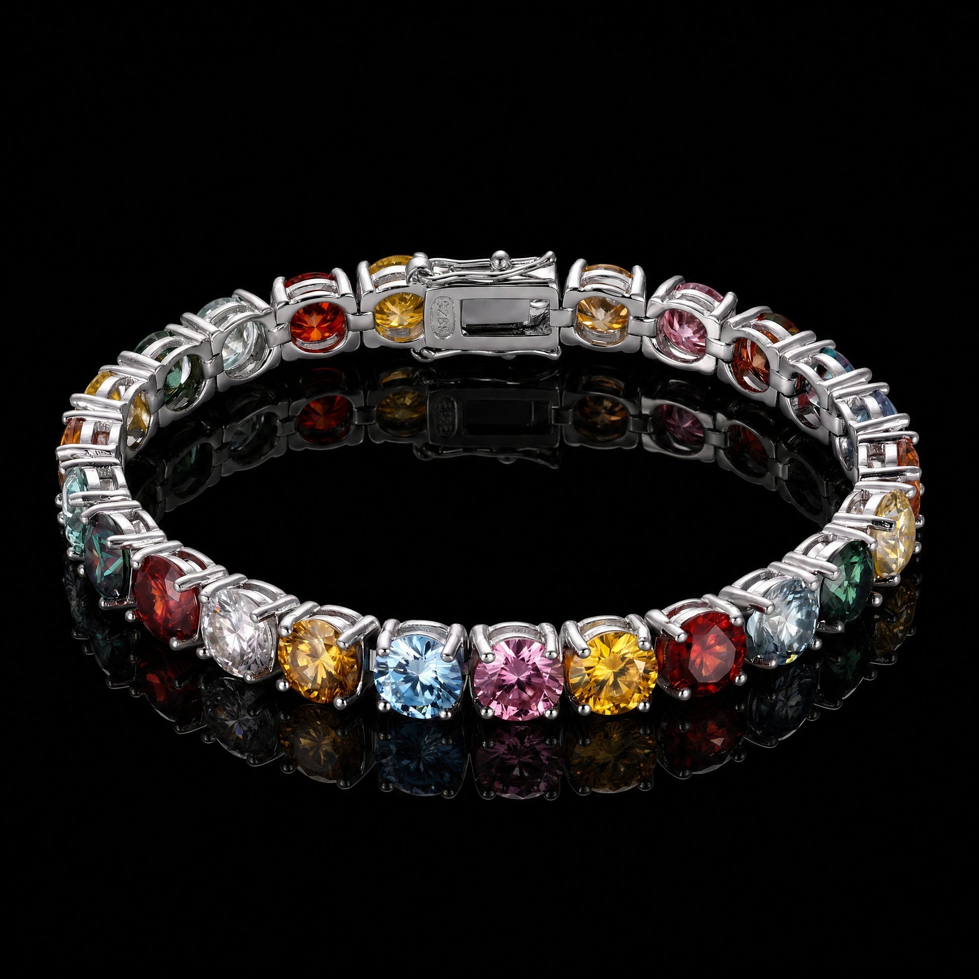 Rainbow moissanite tennis bracelet with scattered multicolor round-cut stones in 925 sterling silver, box clasp, on a reflective black surface - Sensitive Stones