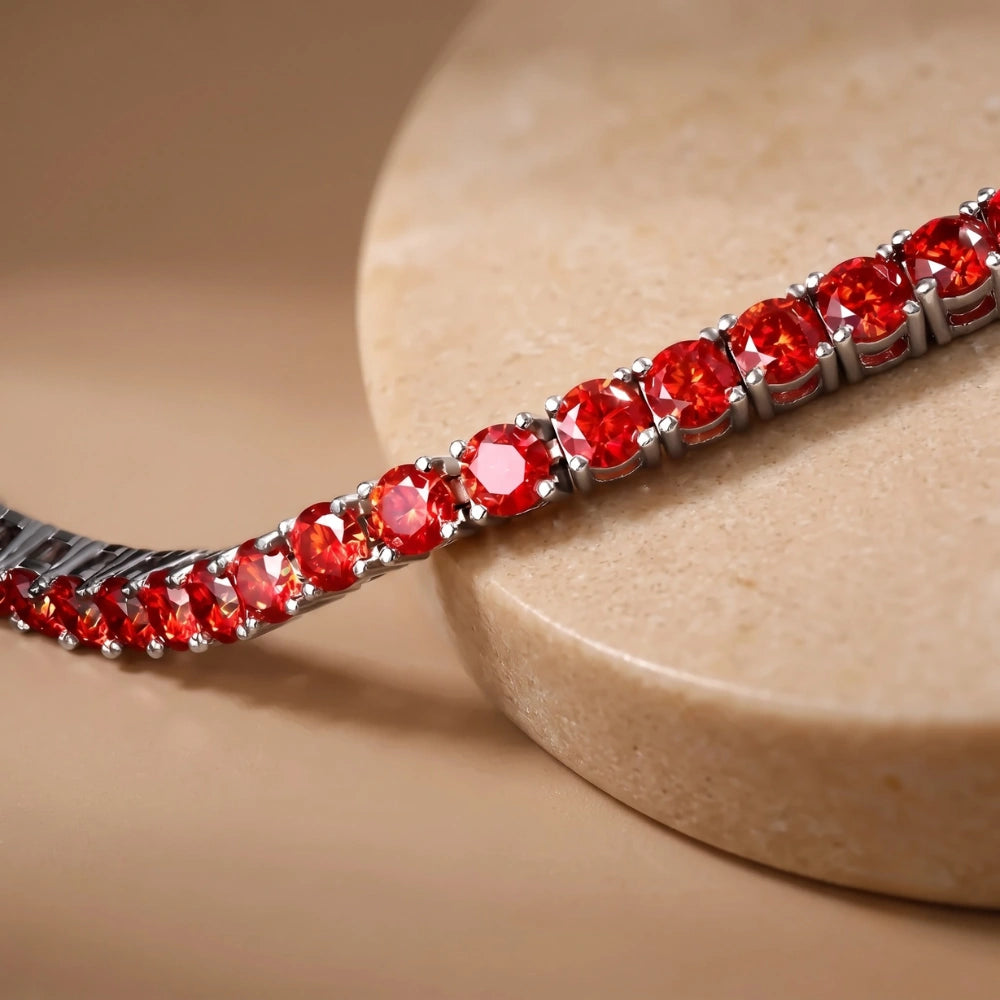 Macro shot highlighting brilliant round-cut red moissanite stones in prong setting – Sensitive Stones