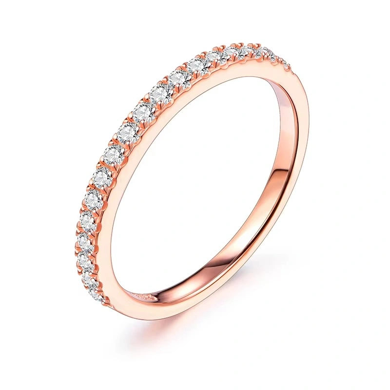 18K rose gold plated moissanite ring set in solid 925 sterling silver in a half eternity band design on a white background - Sensitive Stones
