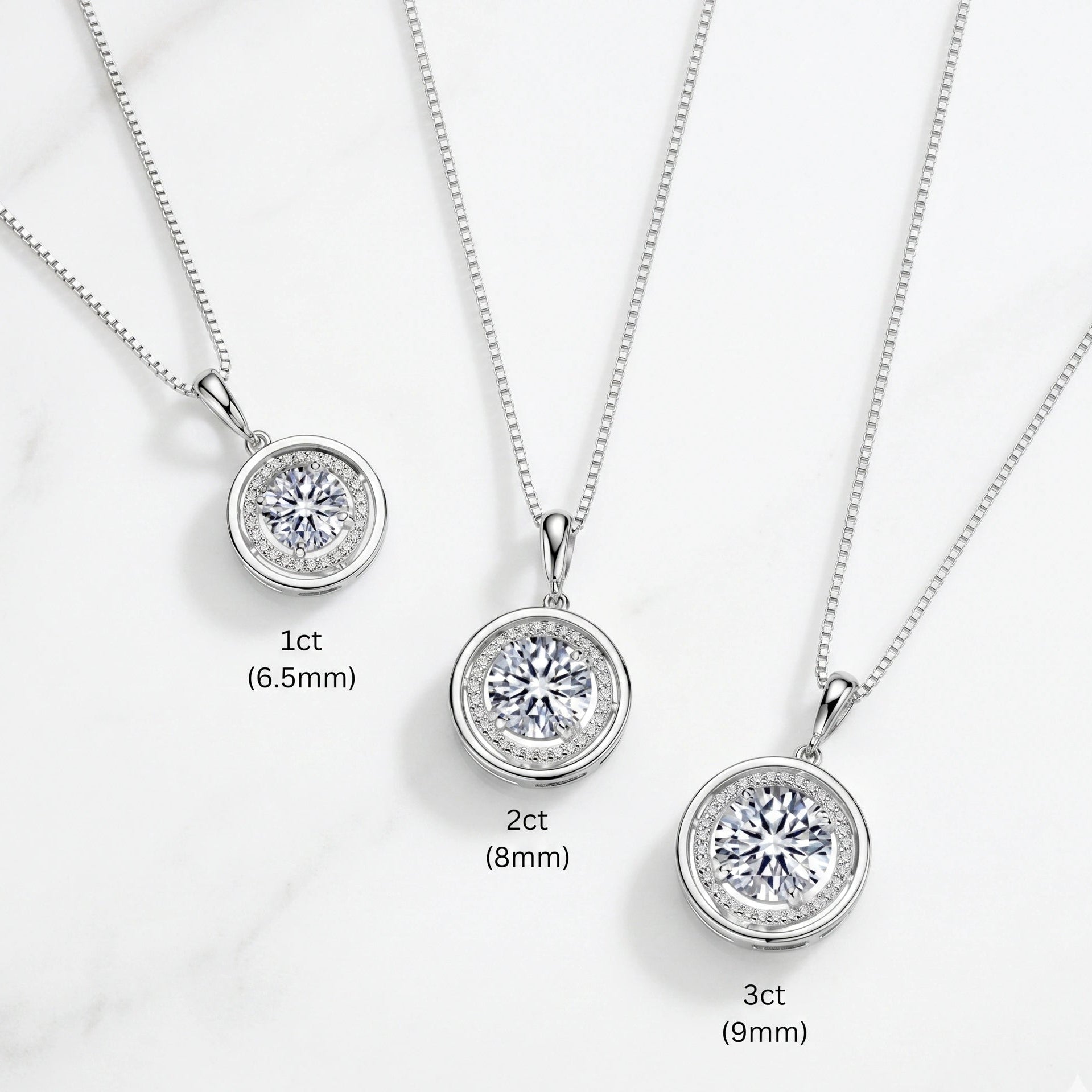 Round moissanite halo pendant necklace size comparison showing three options: 1ct 6.5mm, 2ct 8mm and 3ct 9mm centre stones in 925 sterling silver on adjustable box chain - Sensitive Stones