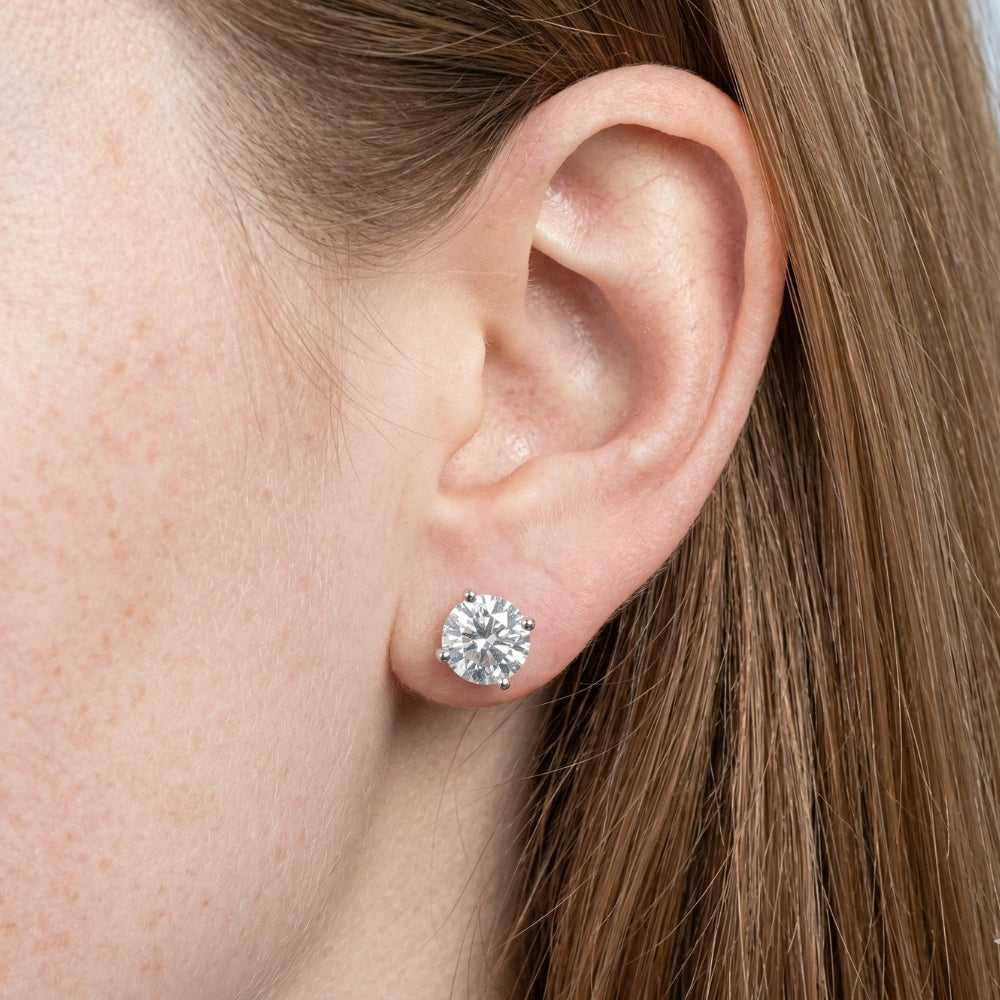 Woman wearing screw back round moissanite solitaire stud earring, 4-prong 925 sterling silver - Sensitive Stones