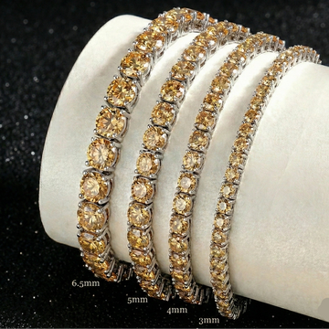 Set of citrine yellow moissanite tennis bracelets in black gold plating on a white stand with sizes 3mm, 4mm, 5mm, 6.5mm - Sensitive Stones
